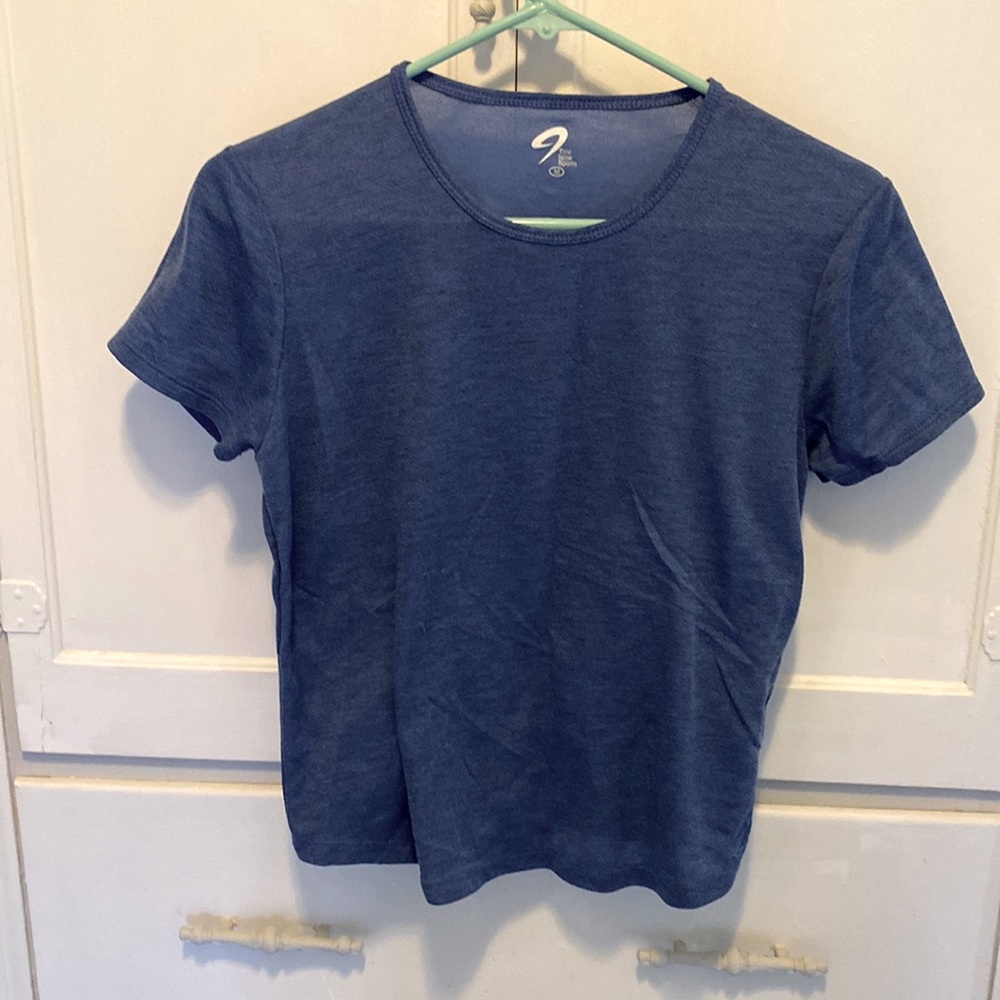 Size Medium blue athletic short sleeved Title Nine Sports tee shirt.